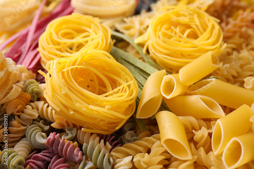 Different types of pasta as background  closeup
