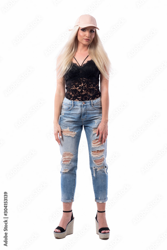 Front view of young blonde caucasian woman in modern casual clothes with arms down looking at camera. Full body isolated on white background. Front view of young blonde caucasian woman in modern casual clothes with arms down looking at camera. Full body isolated on white background.