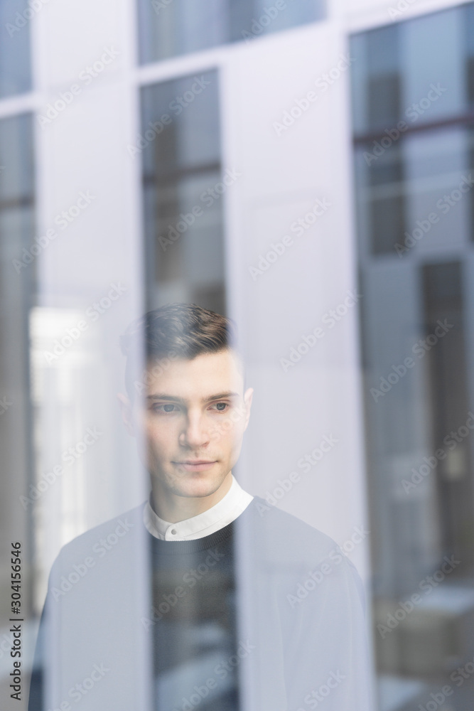 Man looking through window Man looking through window