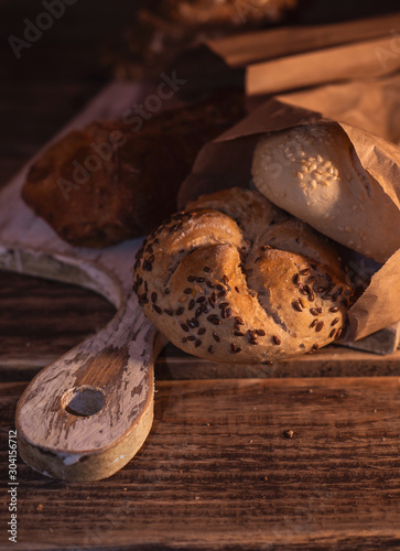 Various homemade bread on rural wooden background