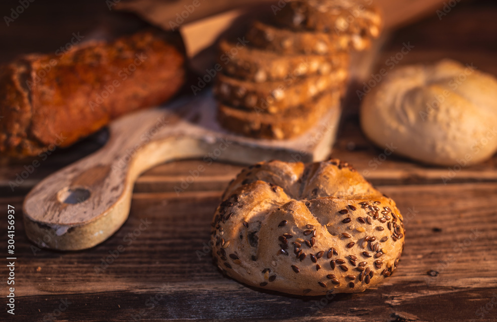 Various homemade bread on rural wooden background