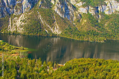 Fototapeta Naklejka Na Ścianę i Meble -  Bird-eye view from the Vogel tramway cabin to the Bohinj Lake with beautiful mountains which reflected in turquoise water. Scenic nature landscape. Vogel ski center, Triglav National Park, Slovenia