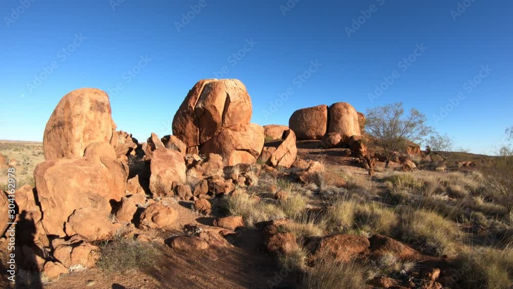 Devils Marbles rock formations at sunset. Australian outback landscape Karlu Karlu - Devils Marbles Conservation Reserve at dusk in Northern Territory, Australia. Devils Marbles rock formations at sunset. Australian outback landscape Karlu Karlu - Devils Marbles Conservation Reserve at dusk in Northern Territory, Australia.