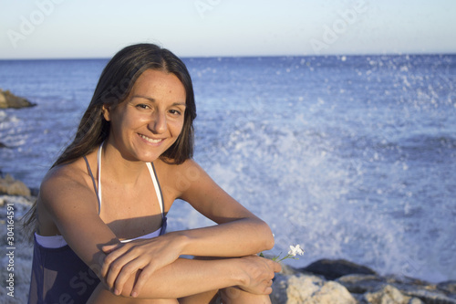 Portrait of smiling young girl with beach background
