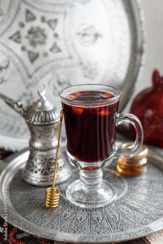 Warm Pomegranate Mulled Wine with Honey. Winter Beverage.