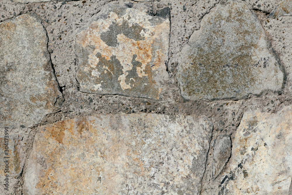 Concrete wall texture background. Natural stones. Building's facade decor. Decorative plaster. House exterior. Concrete wall texture background. Natural stones. Building's facade decor. Decorative plaster. House exterior.