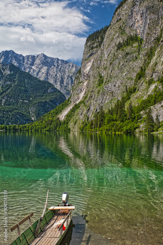lake Obersee with boat and view at alps © mschauer