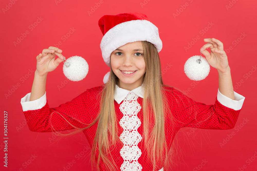Add some decorations. Christmas decorating ideas. Child Santa Claus costume  hold christmas balls. Universal decorations. Christmas decor. Winter  holidays. Playful mood. Snowball concept. Happy kid Stock Photo | Adobe  Stock