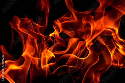 Red fire forms abstraction in black background