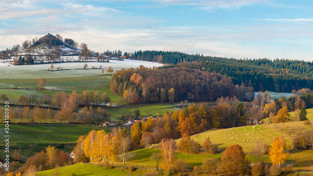 autumn landscape and snow capped hill