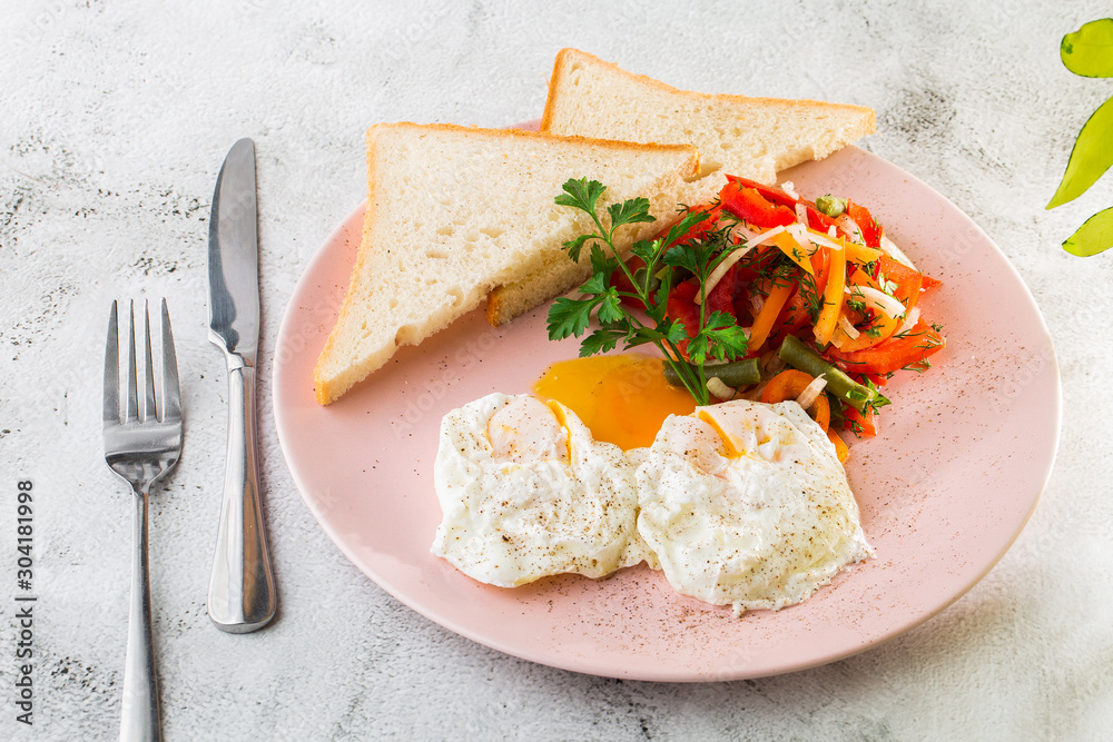 Poached eggs with vegetable and sourdough toast isolated on white marble background. Homemade food. Tasty breakfast. Selective focus. Hotizontal photo. Poached eggs with vegetable and sourdough toast isolated on white marble background. Homemade food. Tasty breakfast. Selective focus. Hotizontal photo.