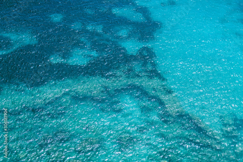 Turquoise sea surface photographed from the top on a long-focus lens.