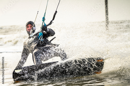 Man kitesurfing in sea