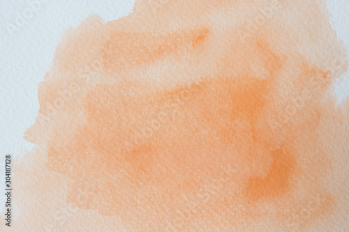 Abstract orange watercolor on white background.
