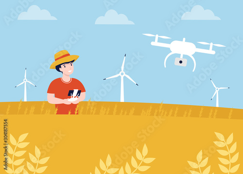 Agronom in the wheat field. Quadrocopter, dron control. Modern Quadcopter with camera flying over field.