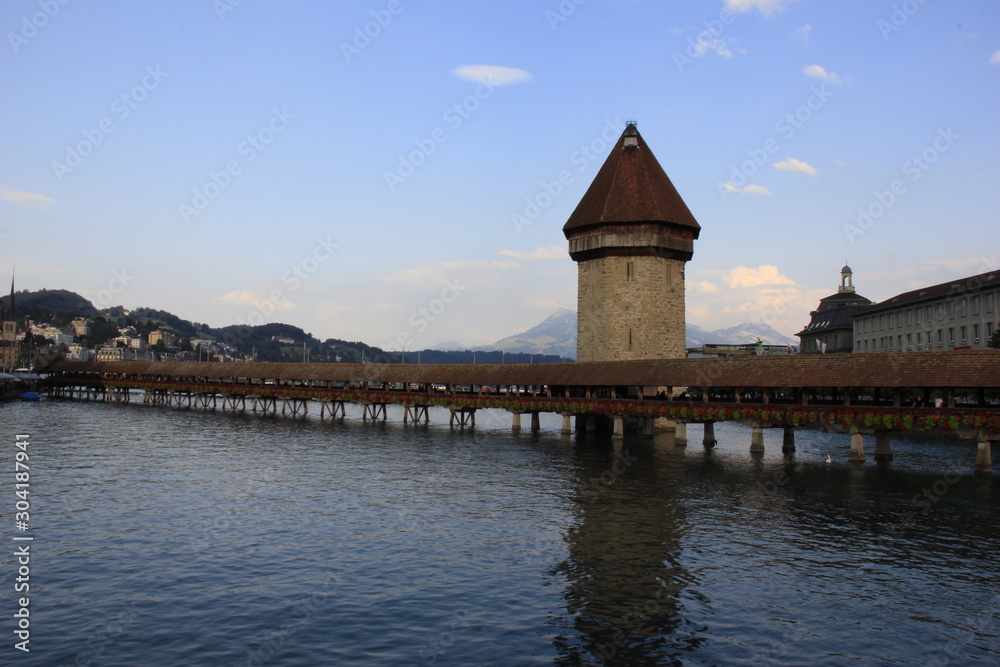 LUCERNE, SWITZERLAND - AUGUST 2013: The famous Chapel Bridge the oldest wooden covered bridge in Europe