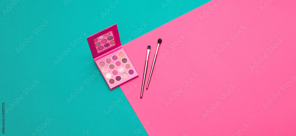 Cosmetic makeup accessories pink flat lay. Fashion creative minimal Set. Trendy eye shadow palette, brushes. Art colorful geometry pink Style. Beauty cosmetic make up tools, fashionable banner - obrazy, fototapety, plakaty 