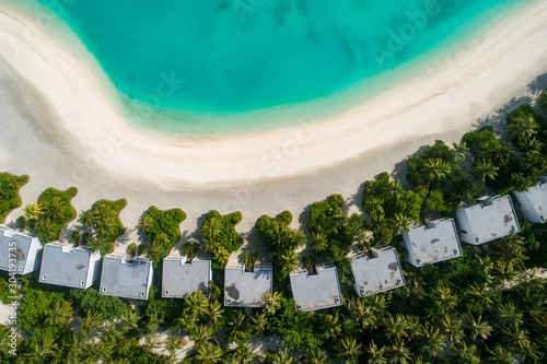 Aerial view of beautiful island at Maldives in the Indian Ocean. Top view from drone. photo