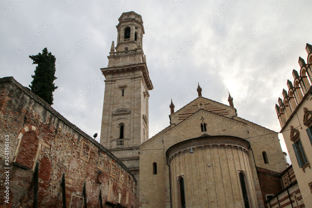 Fototapeta premium The picture from the center of the ancient city of Verona in Italy. The old historic houses and one of the churches. 