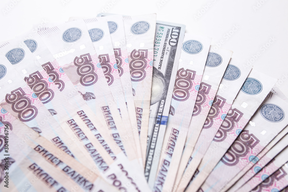 Ruble Russian currency and dollar close-up. Exchange rate. The dollar to ruble exchange rate. Ruble Russian currency and dollar close-up. Exchange rate. The dollar to ruble exchange rate.