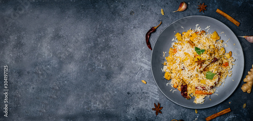 Biryani rice (Vegetable biryani). Indian basmati rice, curry vegetables and spices. Indian kitchen photo