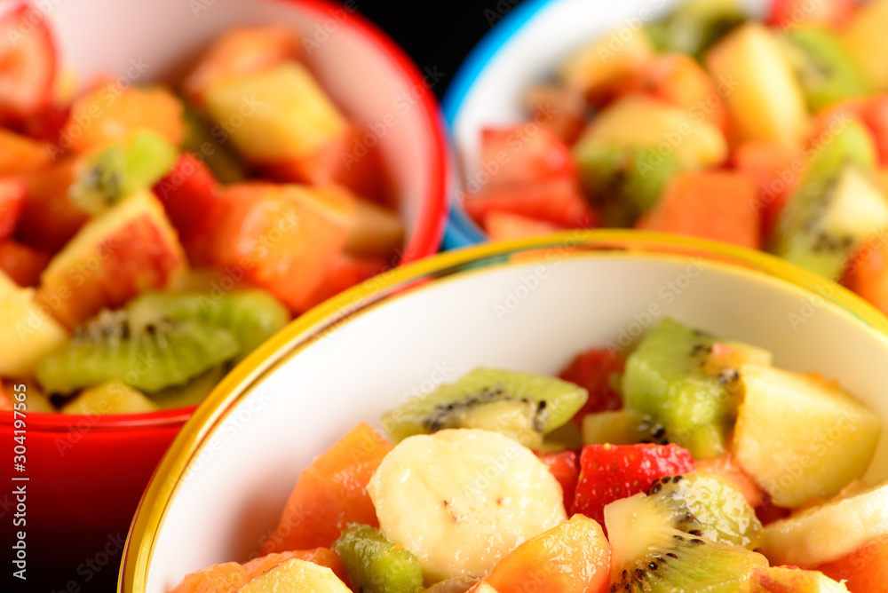 fruit salad in colorful bowls
