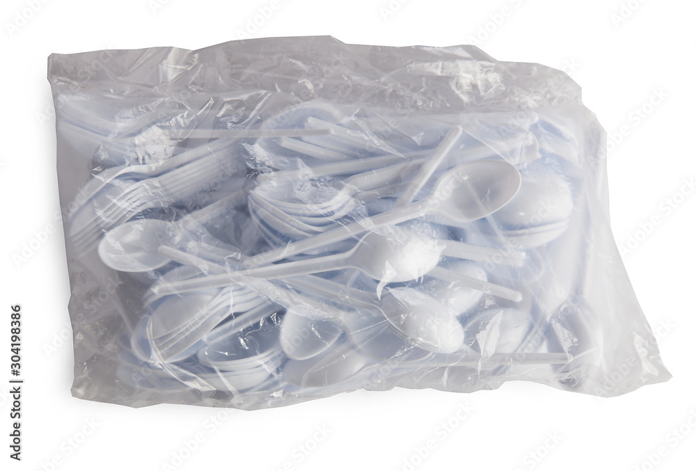 plastic disposable forks and knives, spoons in a set on a white background plastic disposable forks and knives, spoons in a set on a white background