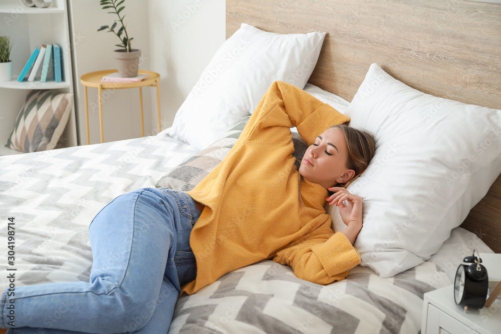 Beautiful young woman sleeping on bed Beautiful young woman sleeping on bed