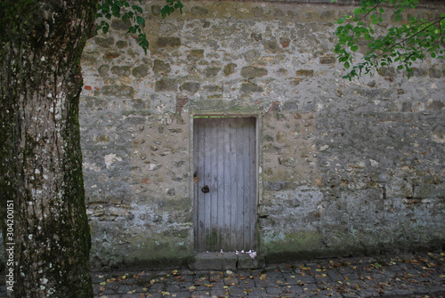 old door in wall © JeanMarie