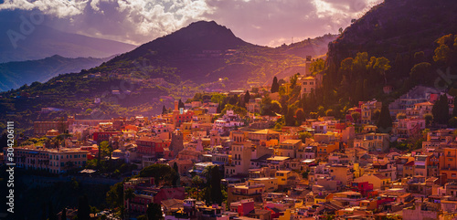A panoramic view of Taormina, Giardini Naxos and Mount Etna, in Sicily, Italy. photo