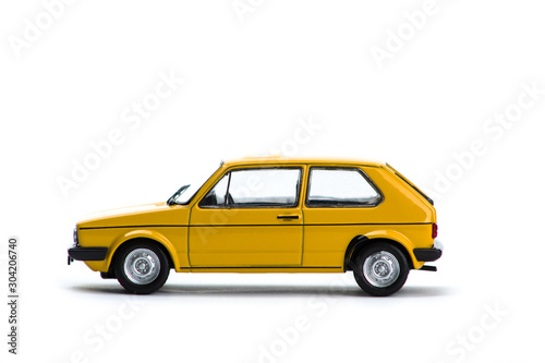 Old yellow car isolated on white background.