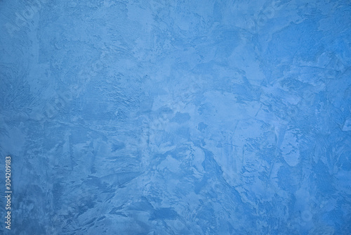 Frozen window patterns. Blue background. Abstraction. Frost