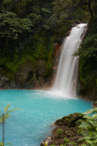 Fototapeta Naklejka Na Ścianę i Meble -  Waterfall of the Celeste River in Tenorio Volcano National Park, Costa Rica
