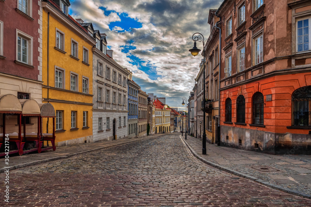 View of Street in Old Town Warsaw with colorful buildings, Poland