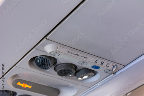 Close Up of Air Flows and Safety Belt Signage on the Airplane