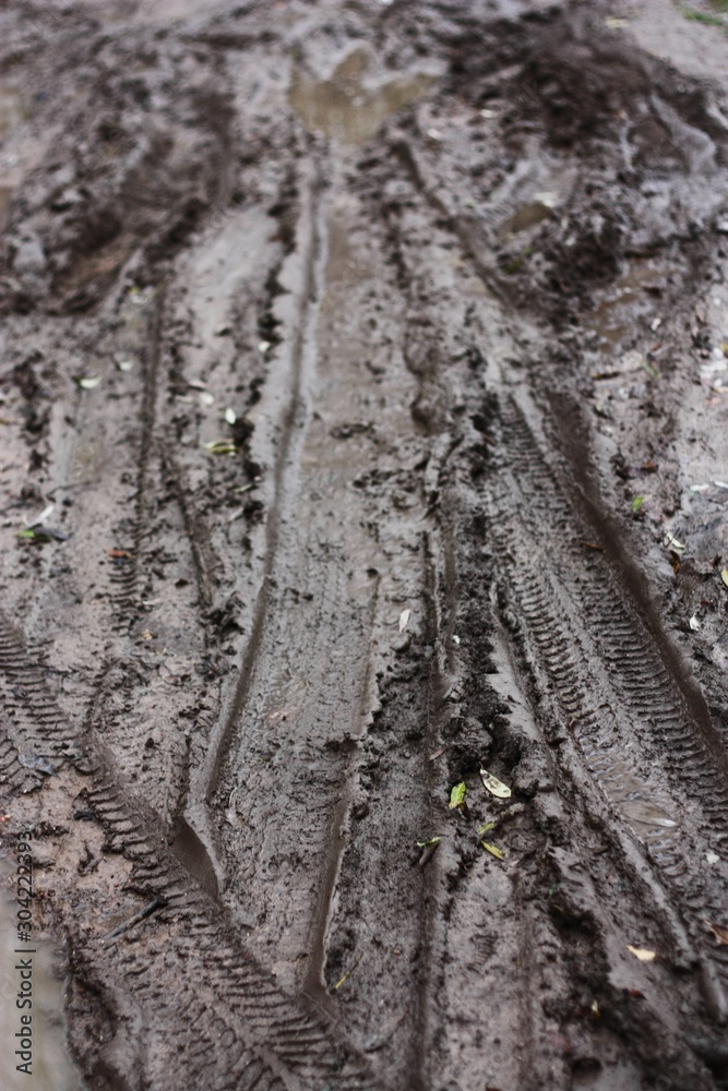 Track from a car wheel on the road Track from a car wheel on the road