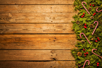 Wooden christmas background with red and green decorative ornament