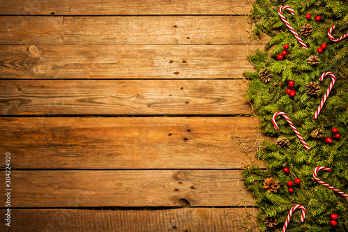 Wooden christmas background with red and green decorative ornament