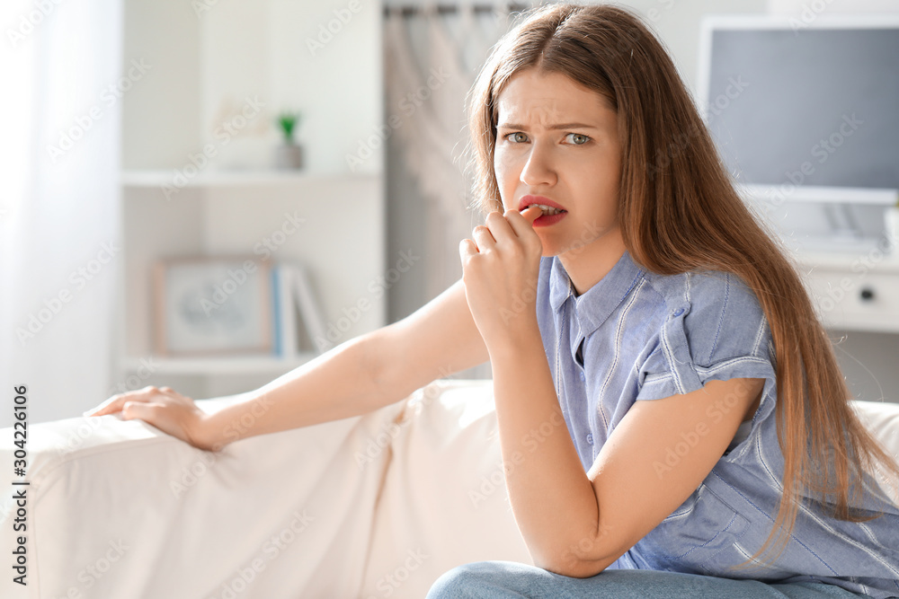 Worried young woman at home Worried young woman at home