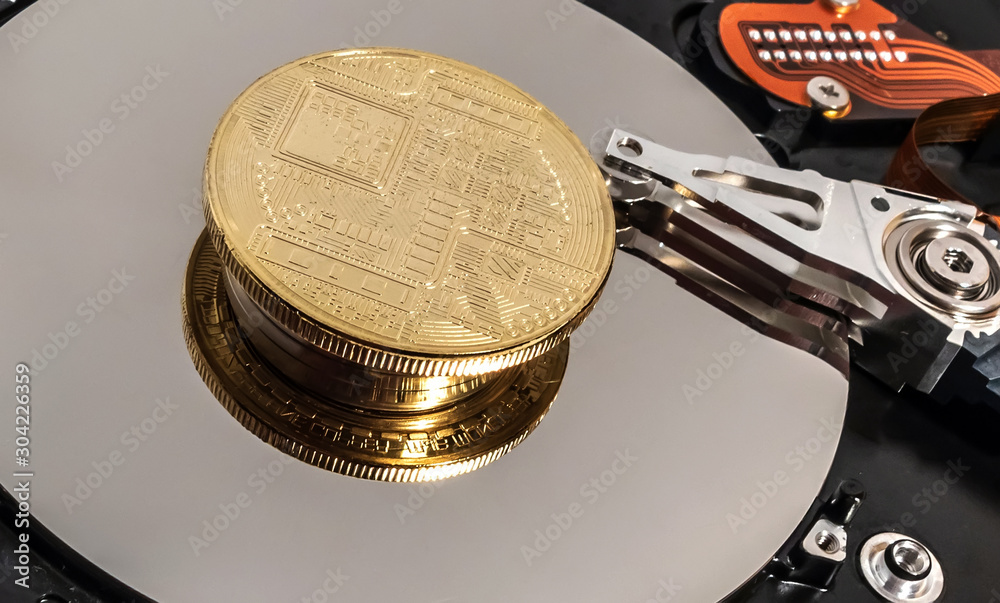 Inside a hard drive blockchain Coin of bitcoin Stock Photo | Adobe Stock