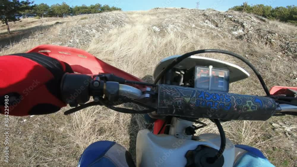 Kocani, Macedonia - 02 Feb, 2019: Offroad bike riding on dirt track driver point of view