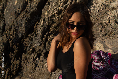 Portrait of young hipster woman with sunglasses enjoying summer. Autumn is approaching with good temperatures. Summer in South America © Tremens Productions