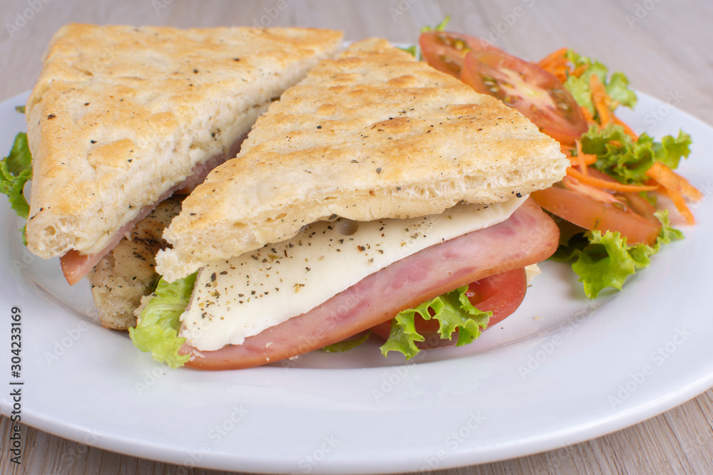 Craft sandwich with oregano, ham, cheese and salad Craft sandwich with oregano, ham, cheese and salad