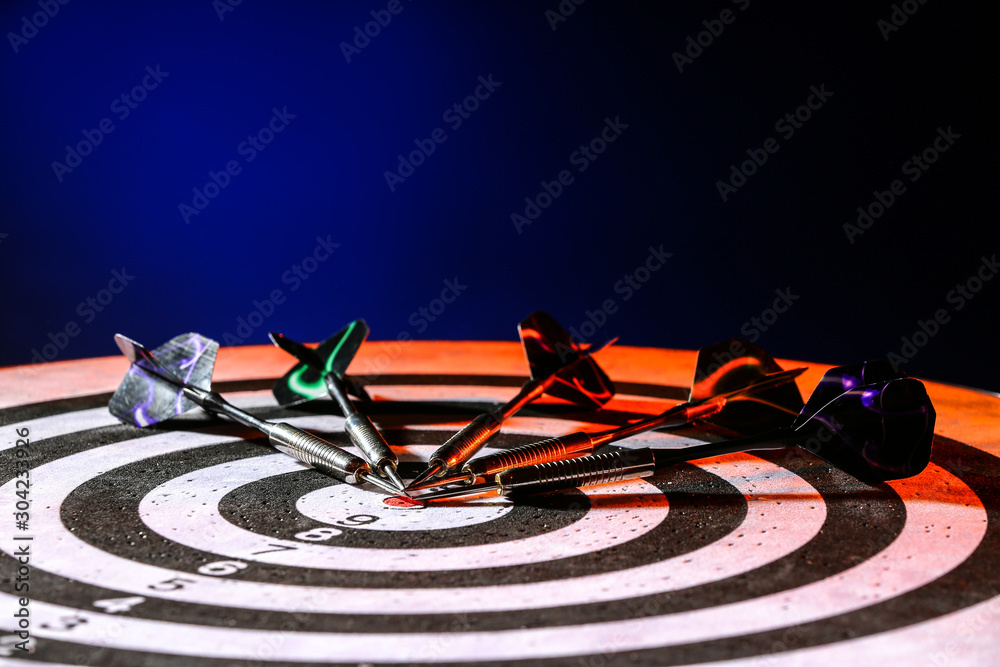 Obraz premium Dartboard with darts, closeup view