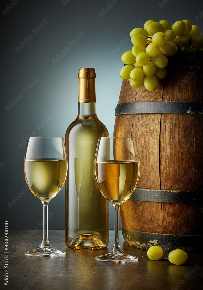 Obraz premium glass and bottle of white wine