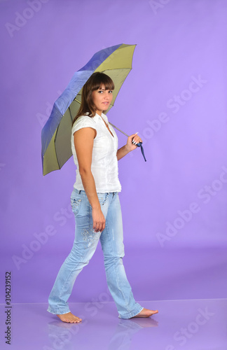 Woman sits and holds umbrella