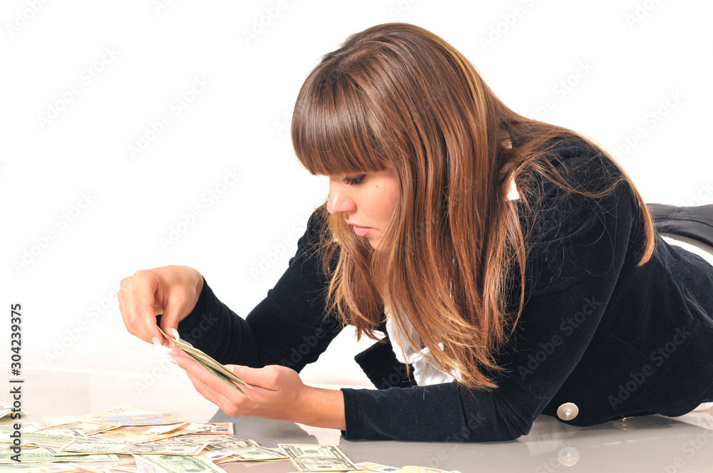 Woman lying near euro and dollar bills Woman lying near euro and dollar bills