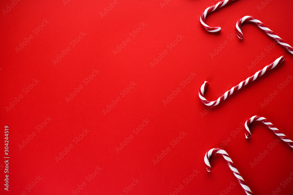 Christmas concept. Christmas candy on a red background. Traditional christmas sweets. Flat lay, place for text. Christmas concept. Christmas candy on a red background. Traditional christmas sweets. Flat lay, place for text.