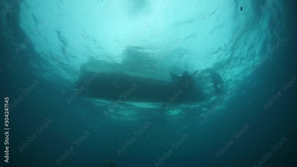 Shipwreck diving in underwater submarine world of shipwrecked ships from World War II as result of military battles on Truk Islands.