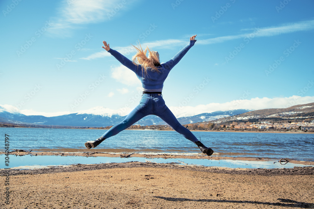 girl jumping for joy to see